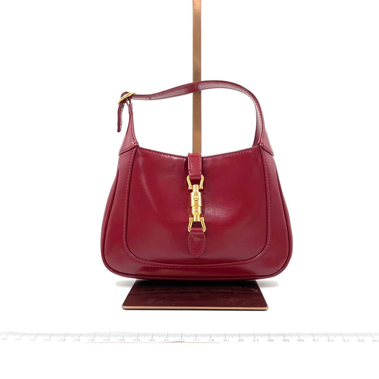 Gucci Jackie Burgundy Adjustable Strap Leather Mini Travel Bag