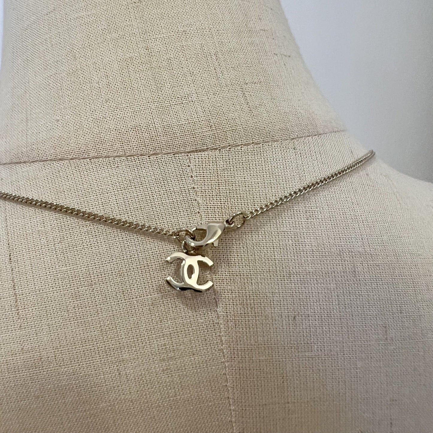 Chanel Bow and Dangling Logo Necklace in SHW (Model: )