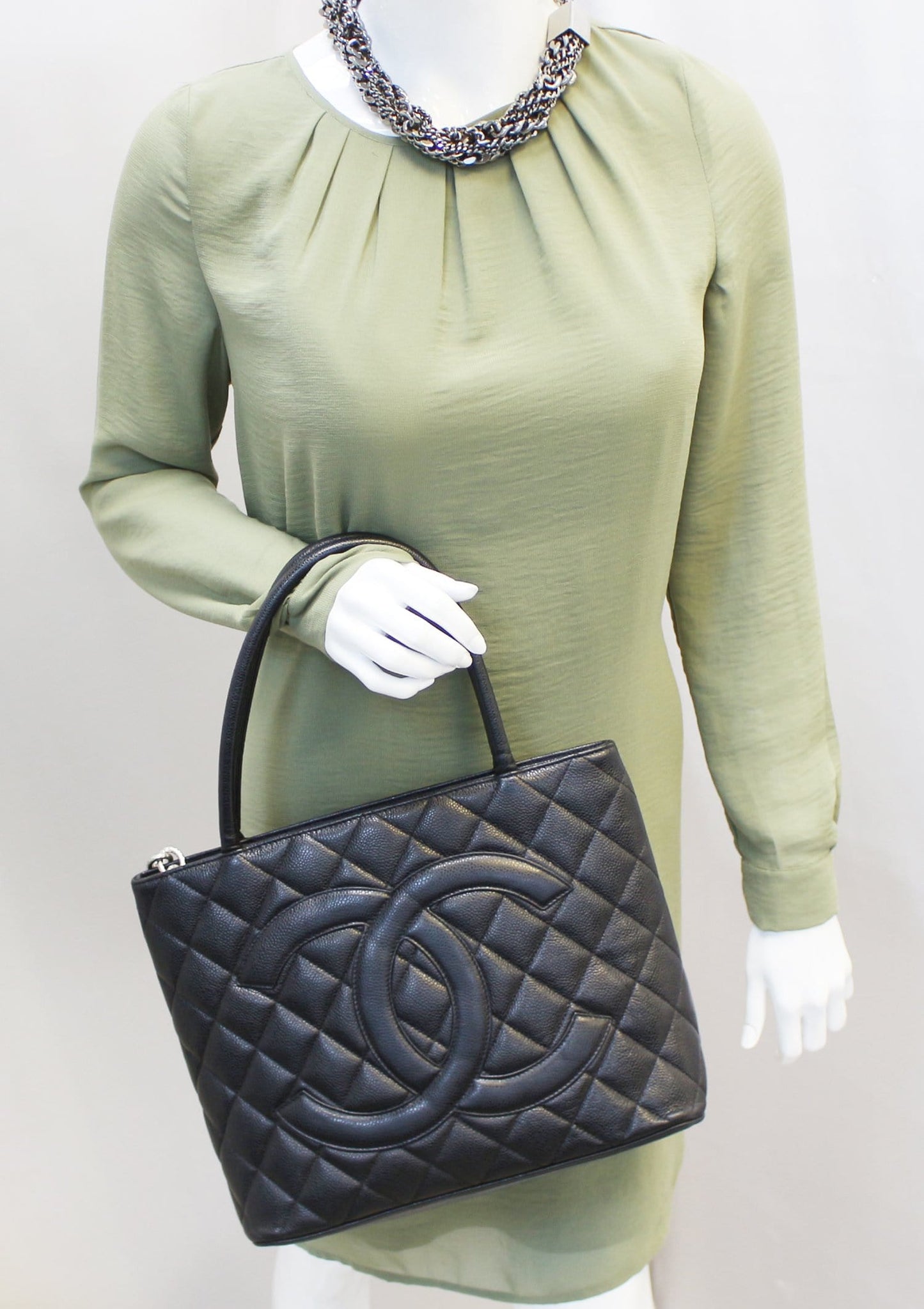 Chanel Quilted Caviar Medallion Leather Black Travel Bag