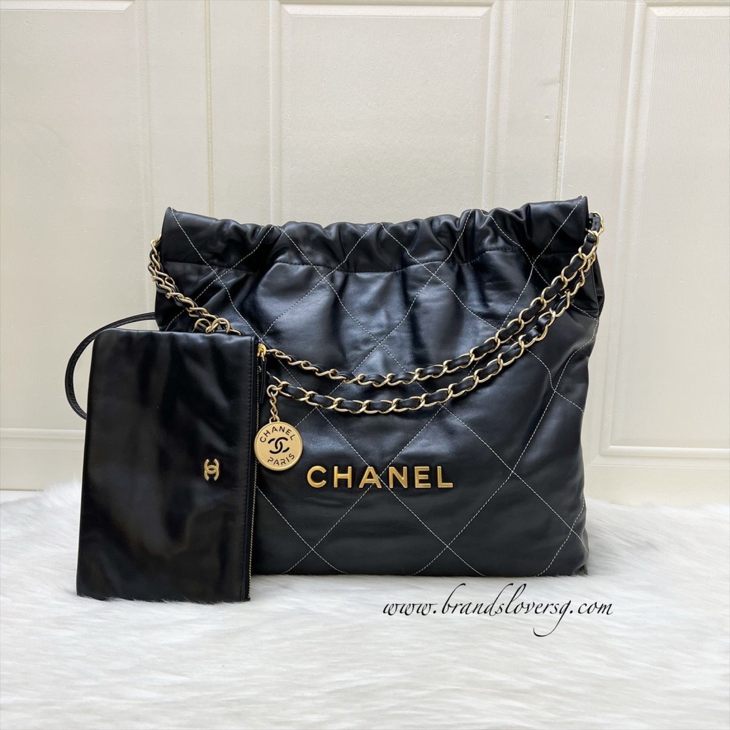 Chanel 22 Medium Hobo Handbag in Black Calfskin with White Stitch Quilting and AGHW (Model: )