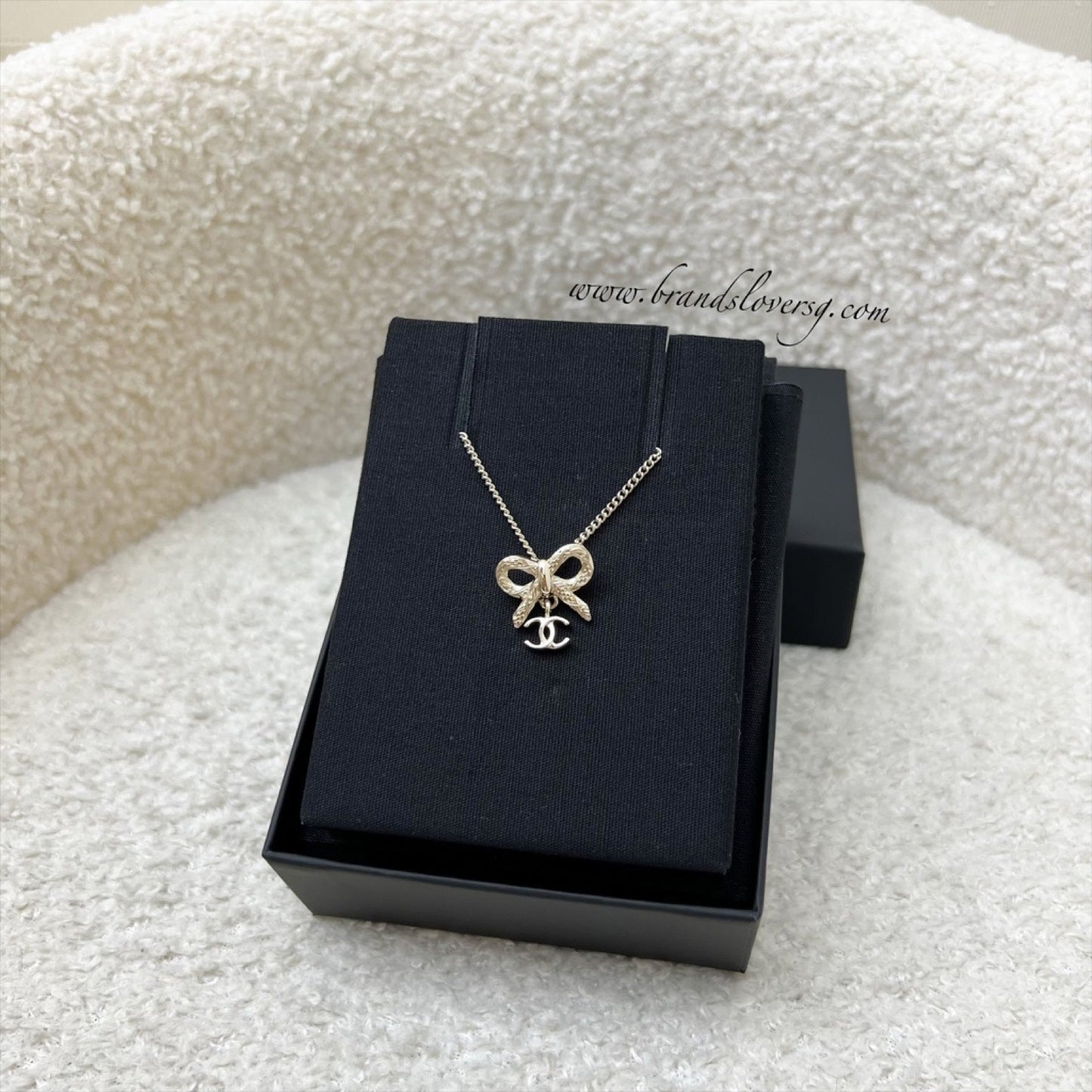 Chanel Bow and Dangling Logo Necklace in SHW (Model: )